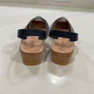 The brand is CalaXini, Size is 39, and color is Navy Blue and White striped